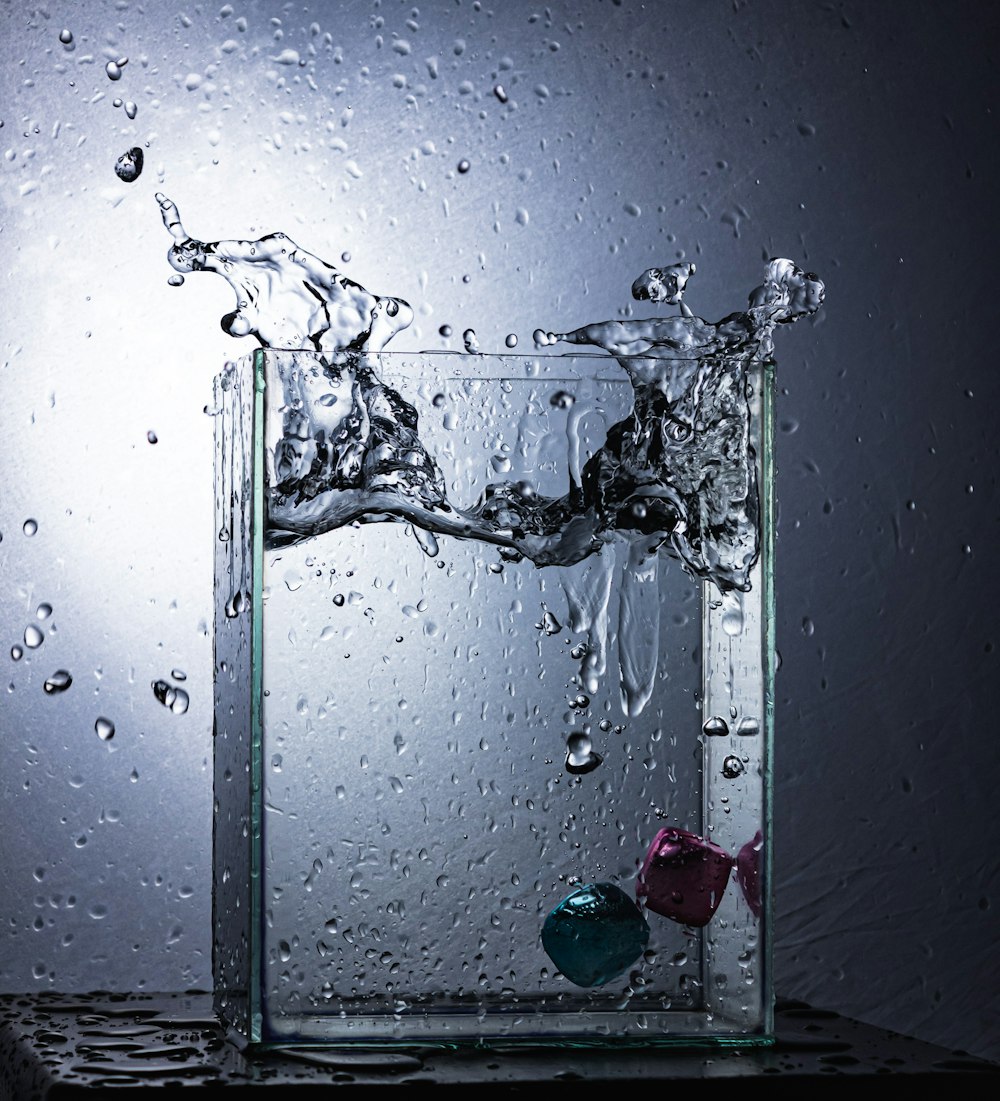 a glass of water with bubbles and bubbles in it