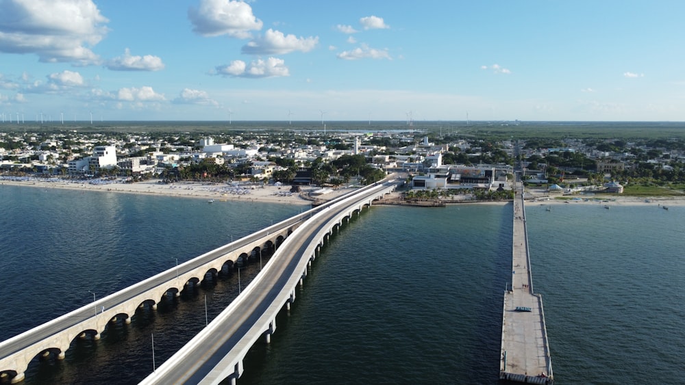 an aerial view of a bridge over a body of water