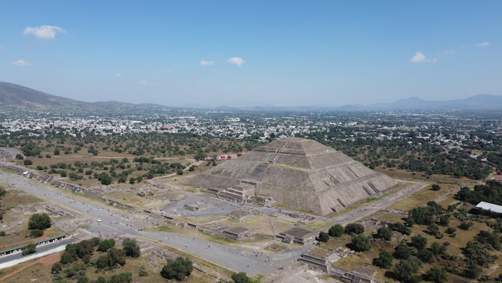 an aerial view of a city and a pyramid