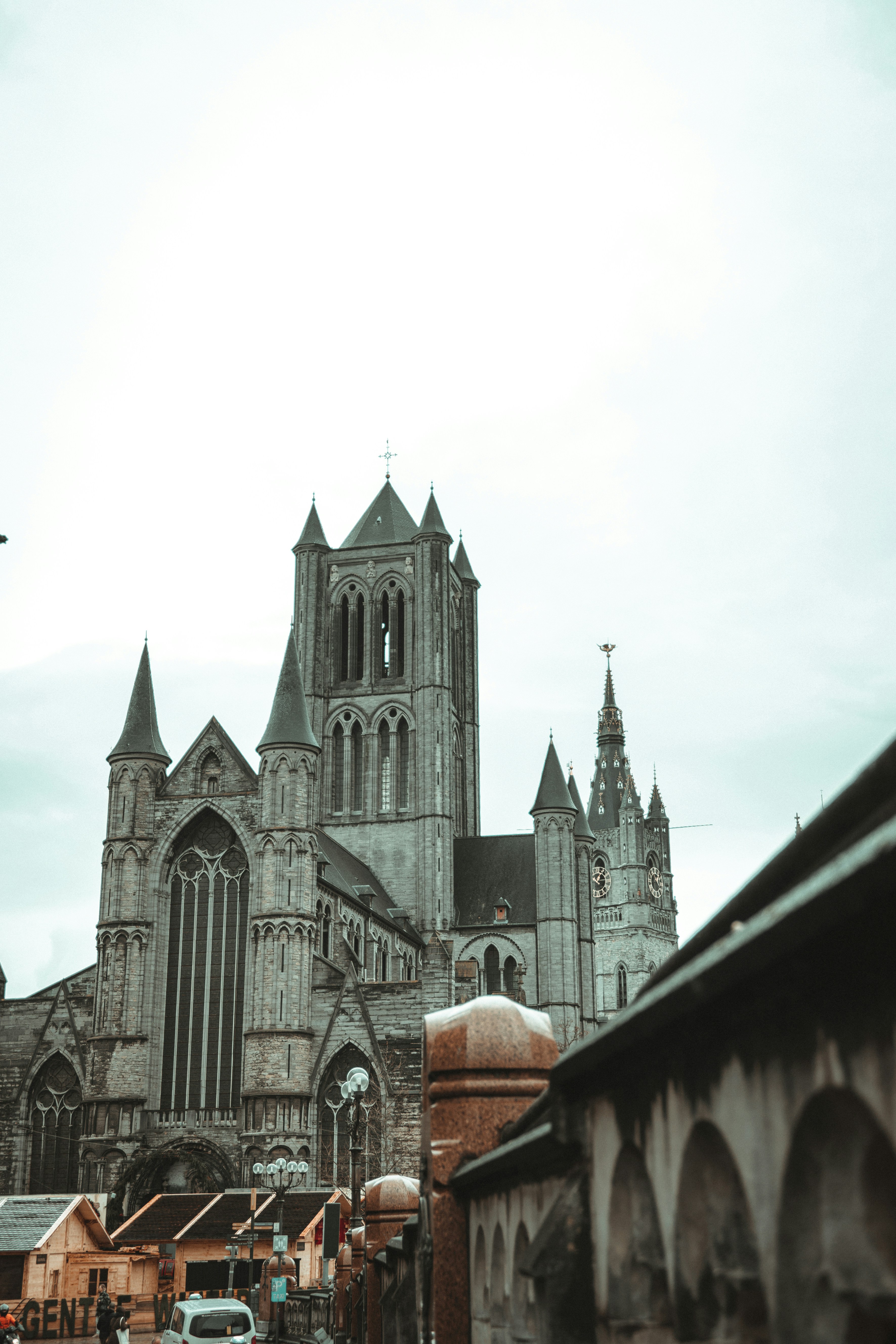 a large cathedral towering over a city filled with tall buildings
