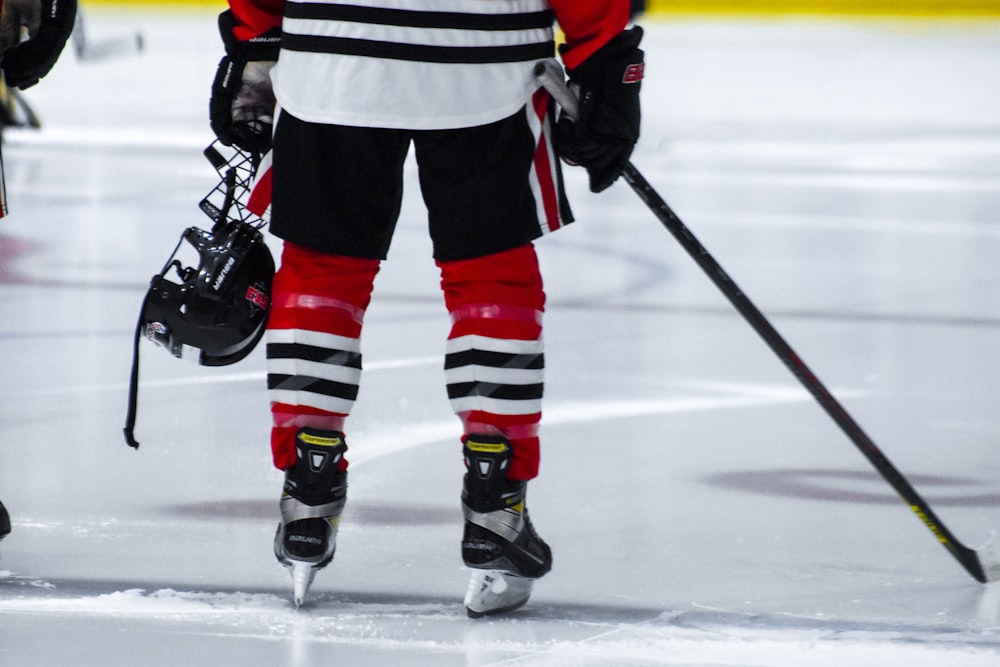 a hockey player with a helmet and hockey stick