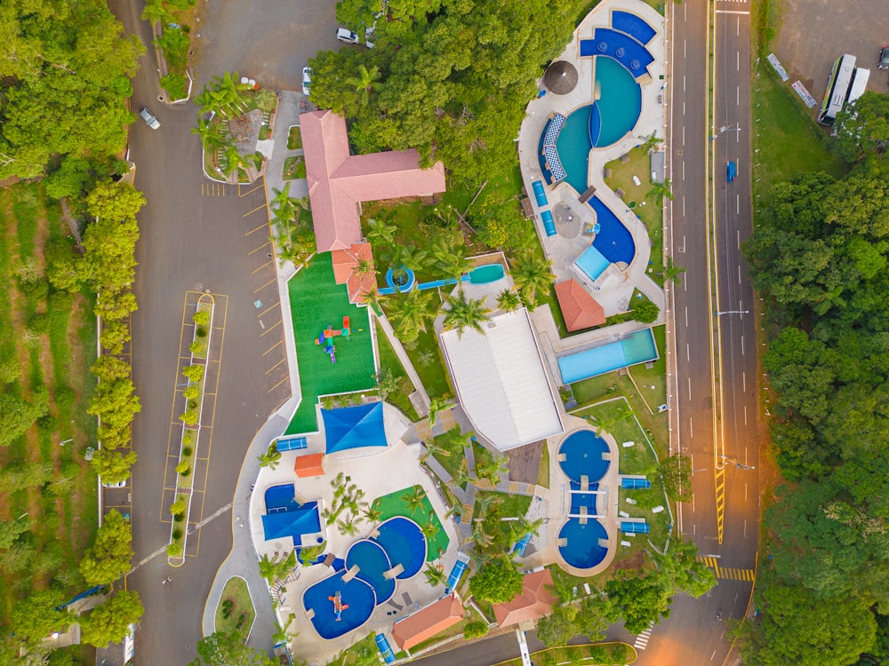 an aerial view of a resort with a swimming pool