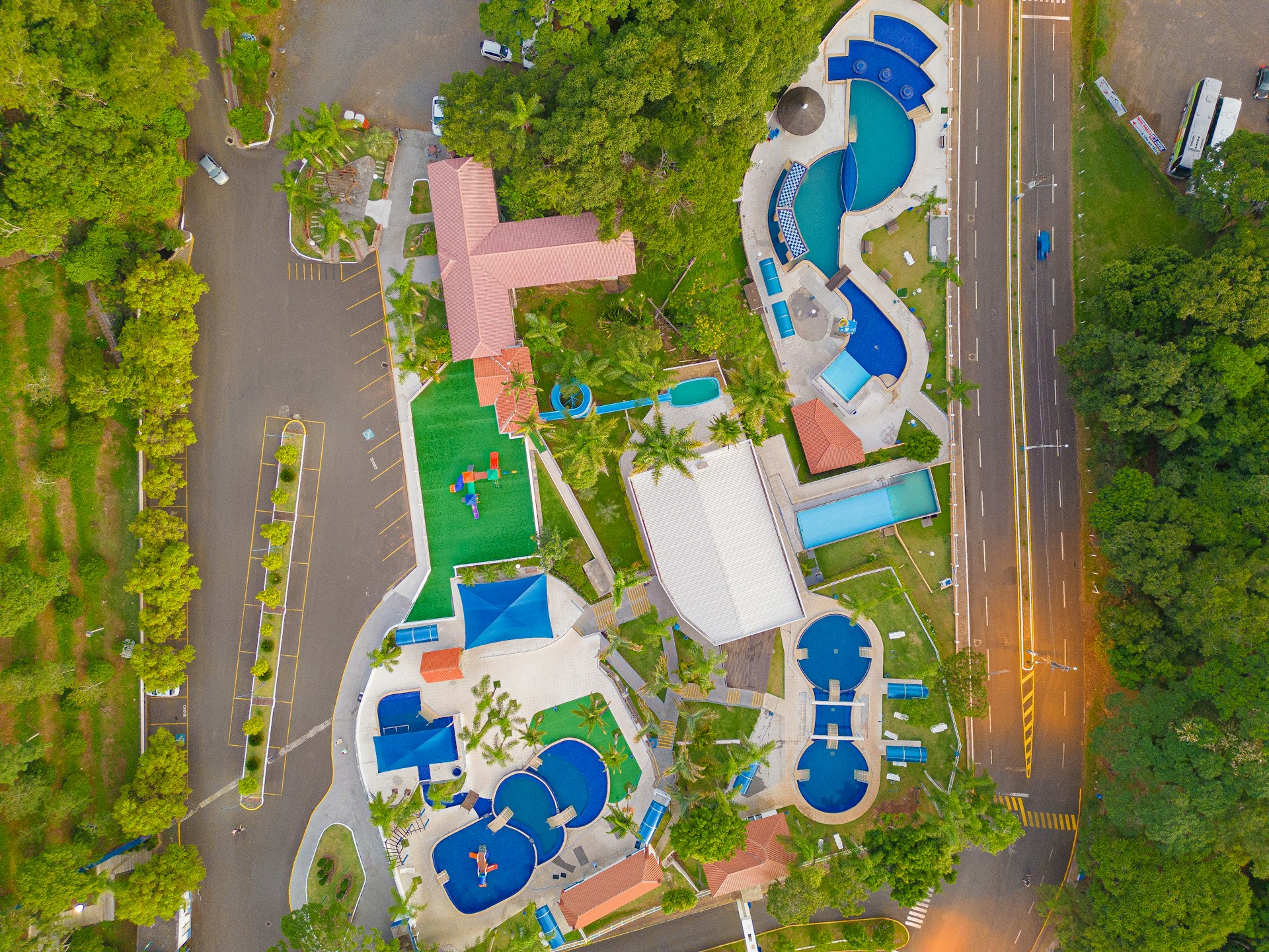 an aerial view of a resort with a swimming pool