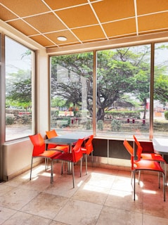 Bright and cheerful dining area at the Valencia branch, featuring comfortable seating and local artwork.