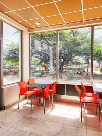 Bright and cheerful dining area at the Valencia branch, featuring comfortable seating and local artwork.