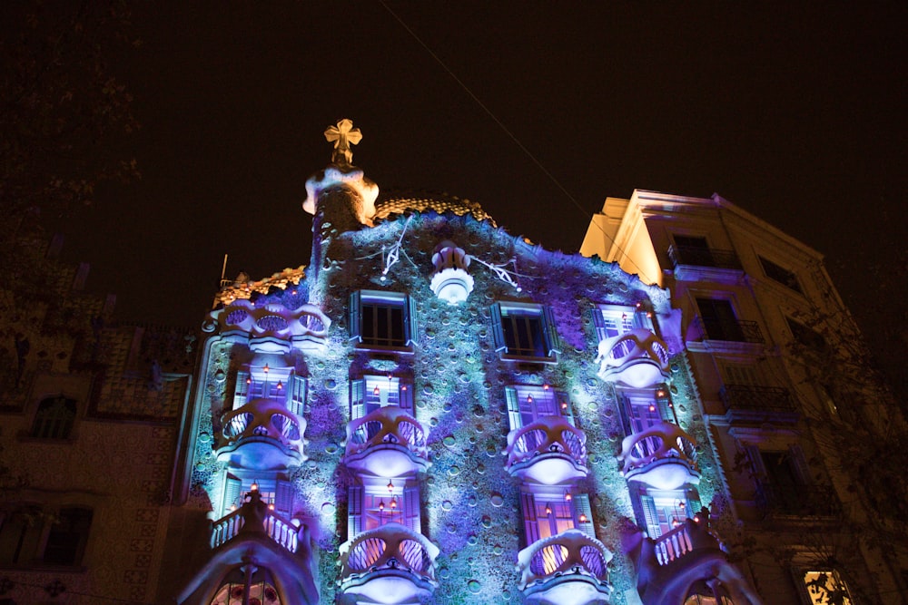 a building is lit up with christmas lights