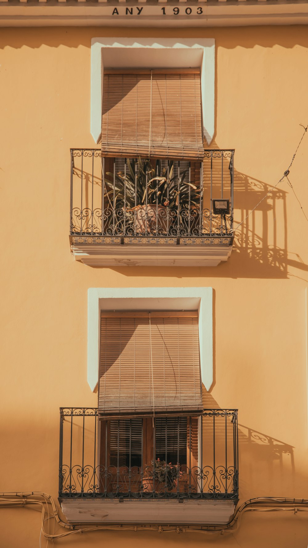 a building with two balconies and a balcony