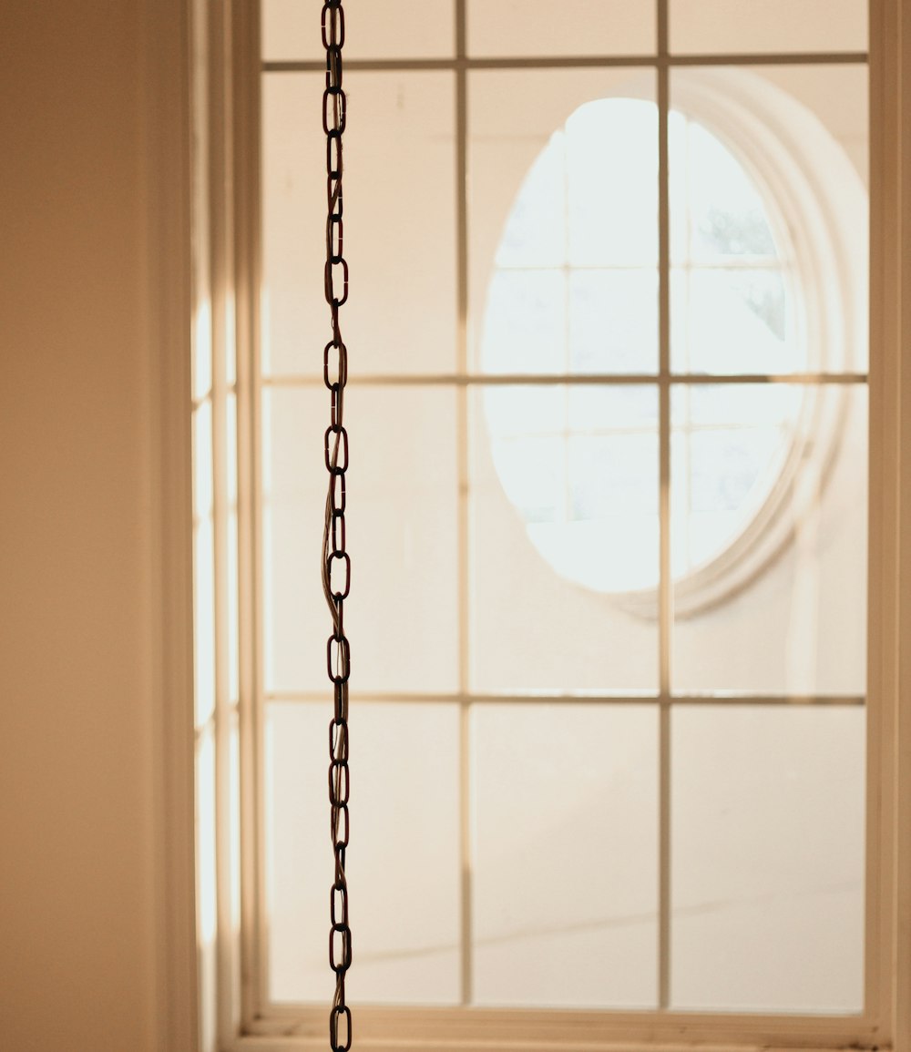 a window with a chain hanging from it