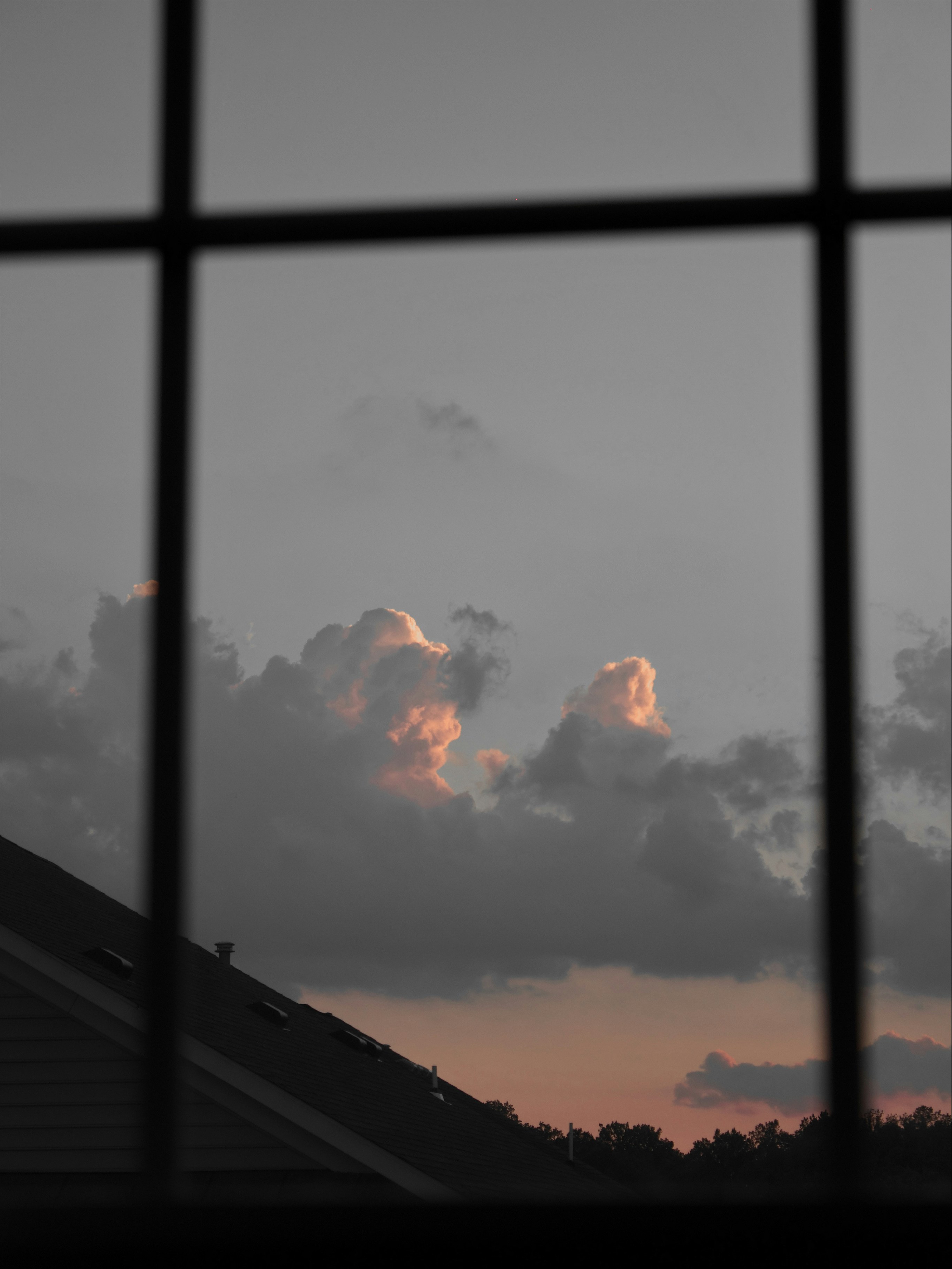 clouds through a bedroom window