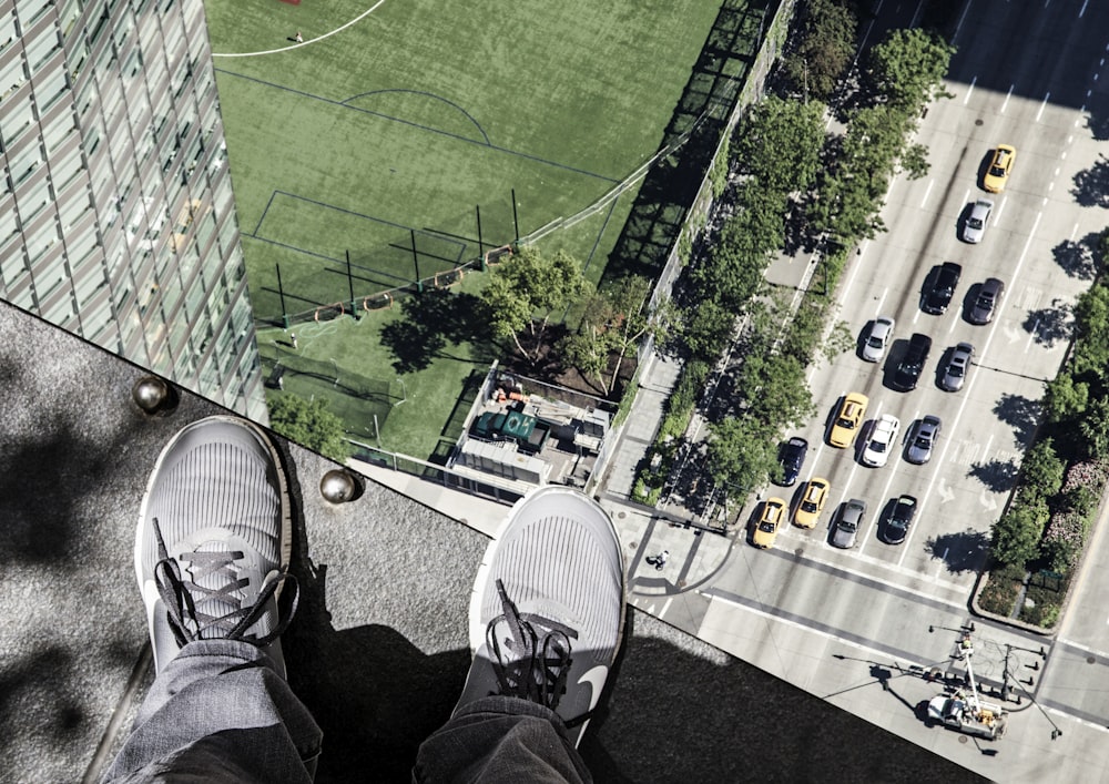 a person standing on top of a tall building