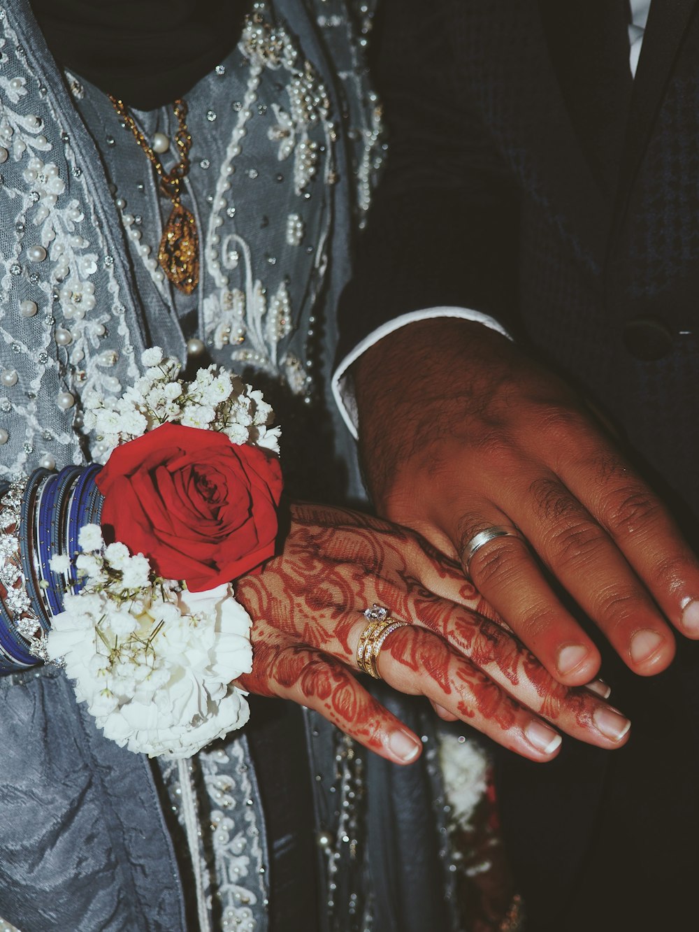 a close up of a person holding a flower