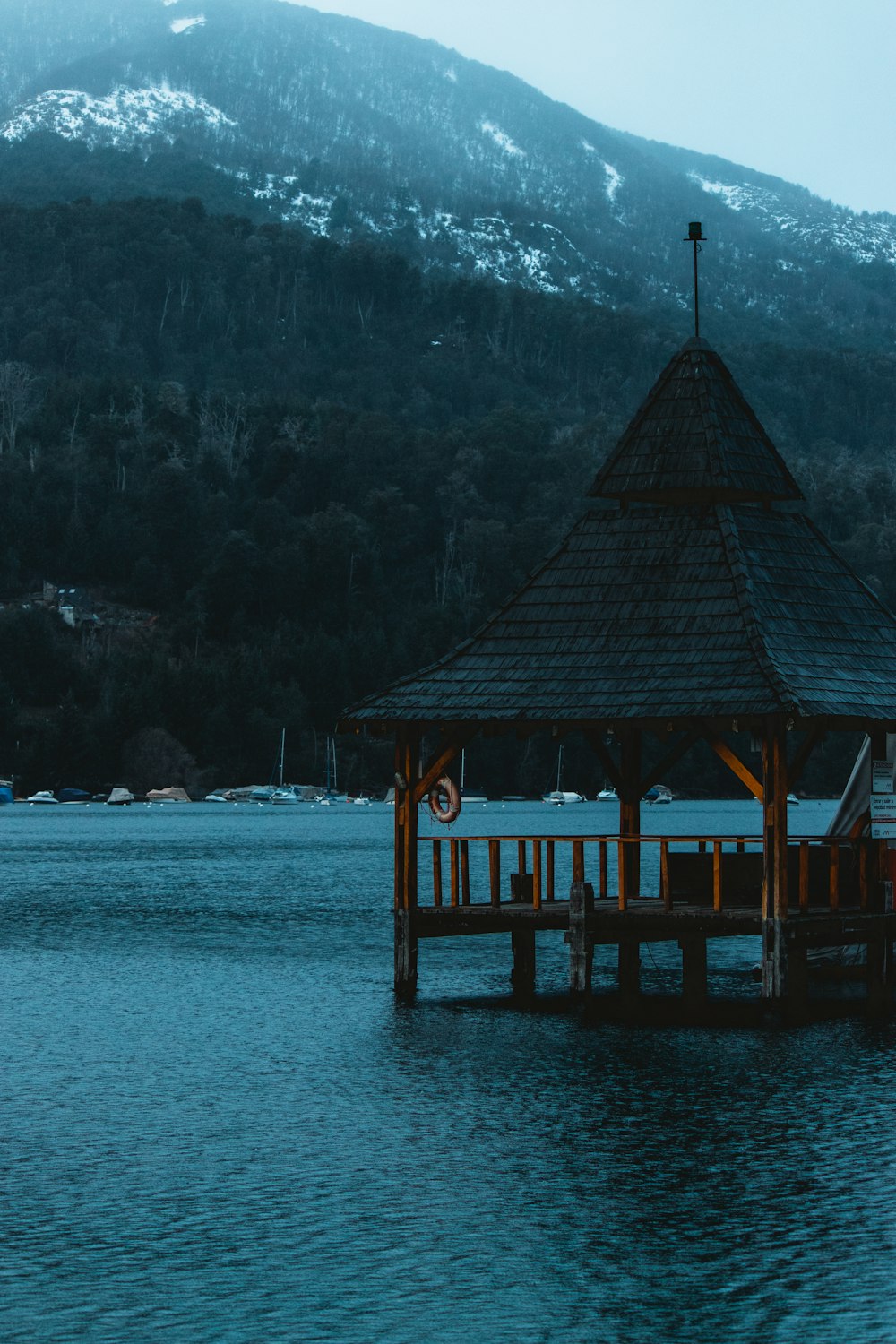 a gazebo in the middle of a body of water
