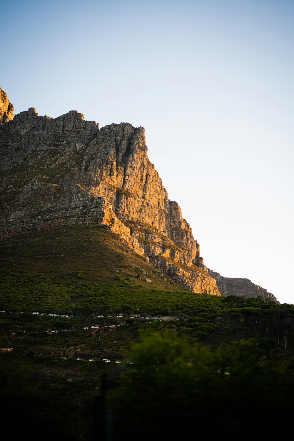 a very tall mountain with a very steep face