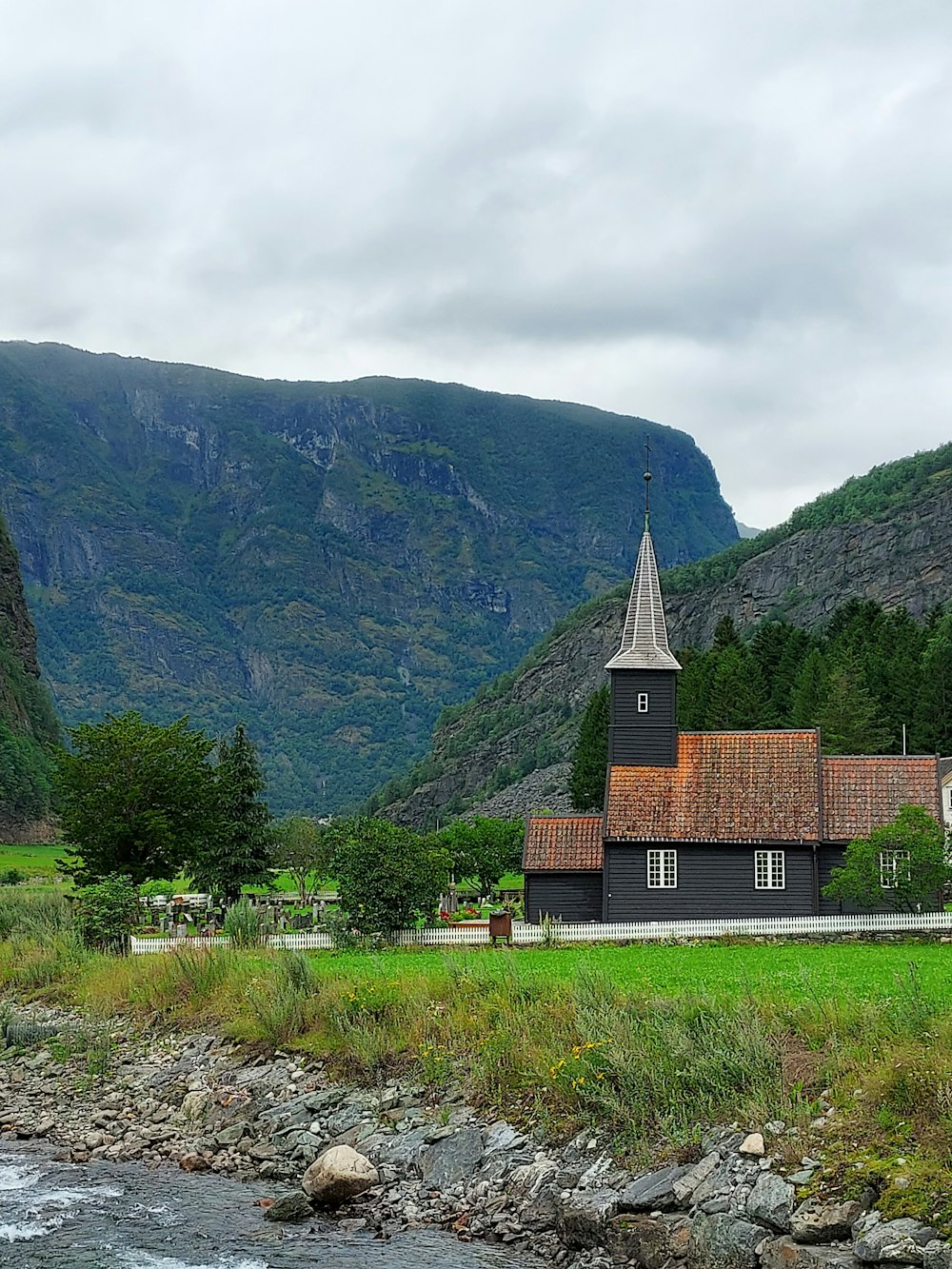 a church in the middle of a mountain valley