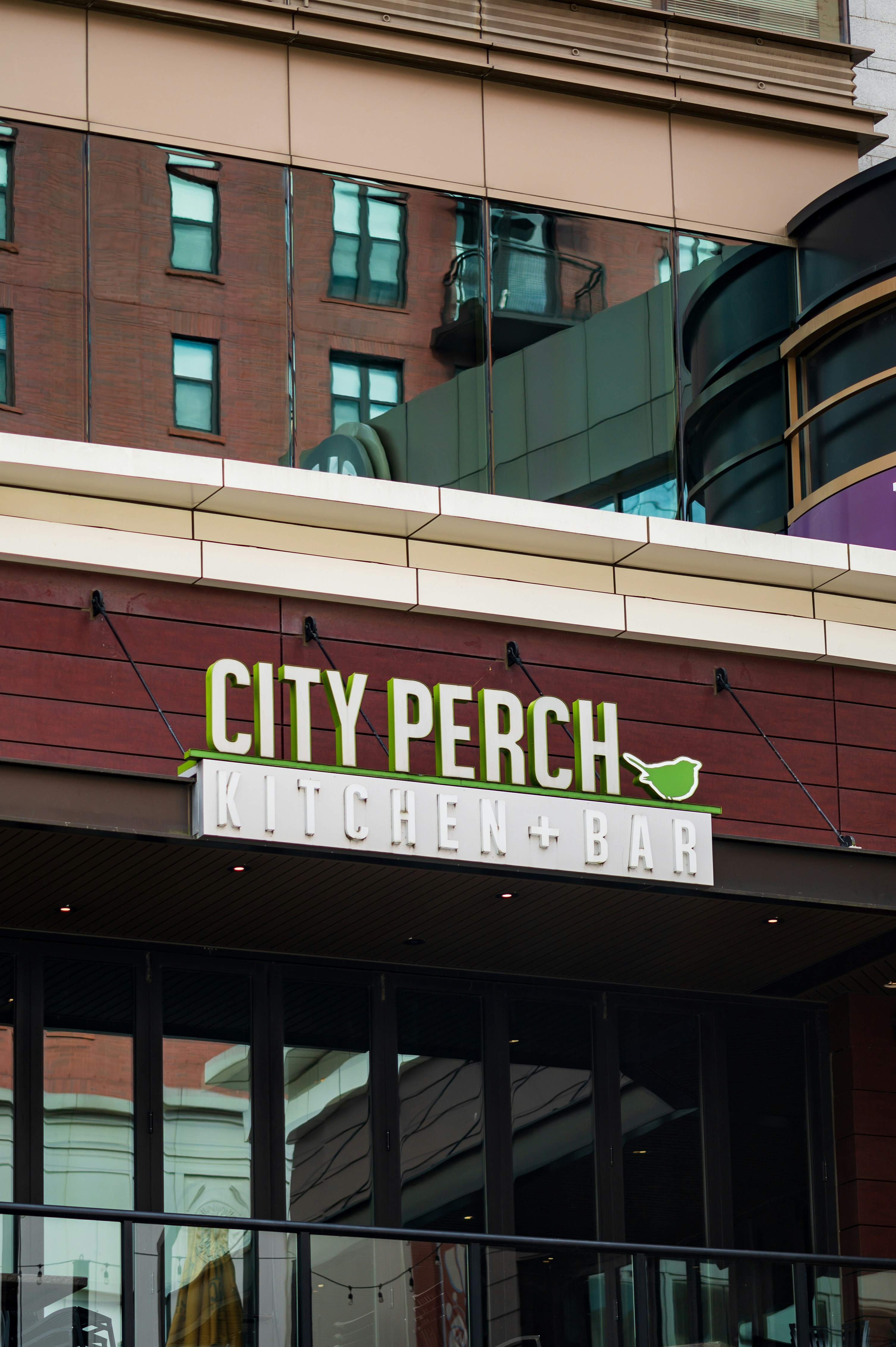 a city perch sign on the side of a building