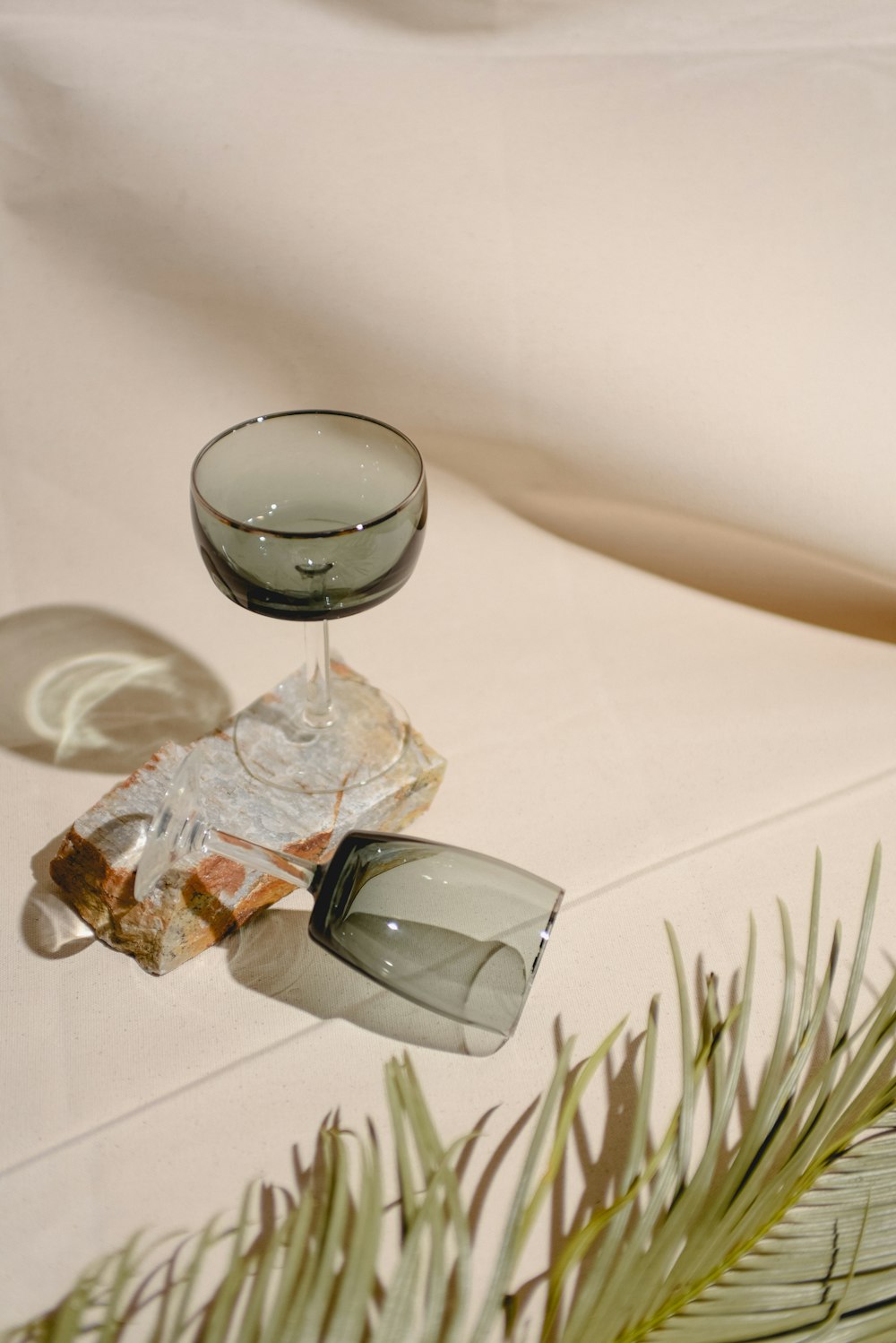 a glass of wine sitting on top of a table