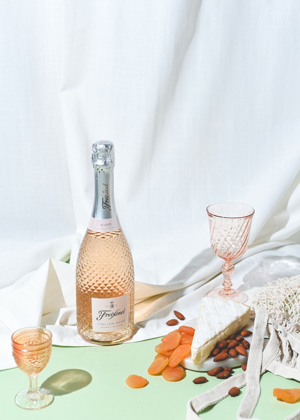 a bottle of wine and a glass on a table