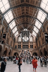 a group of people standing inside of a building