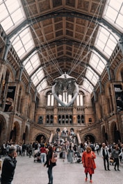 a group of people standing inside of a building