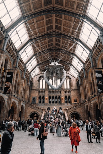 a group of people standing inside of a building