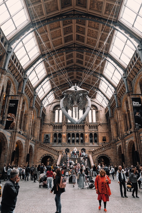 a group of people standing inside of a building