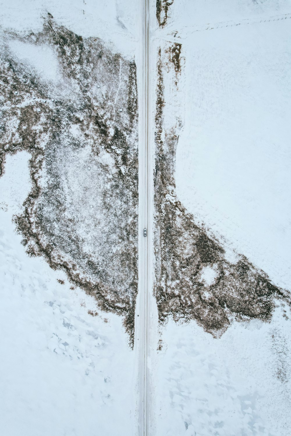 a view of a snow covered road from above