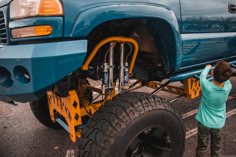 Person standing next to a truck