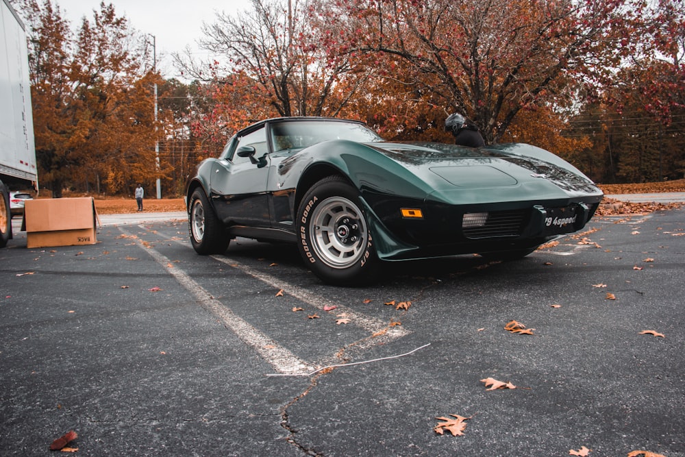 a green sports car parked in a parking lot