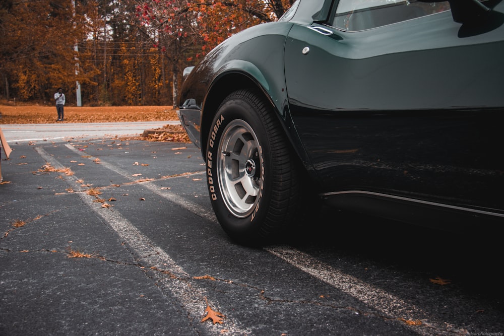 a black car parked in a parking lot