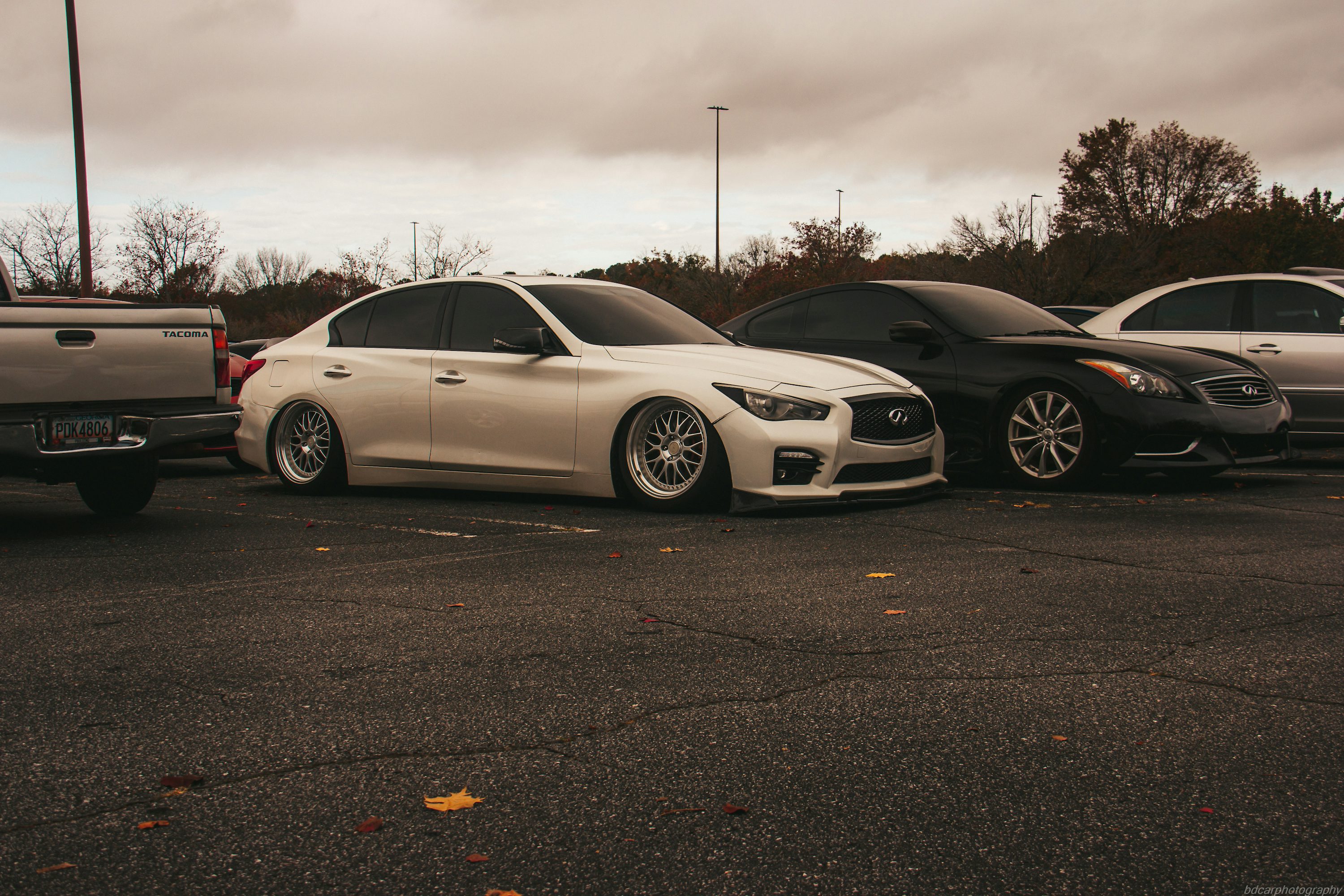 a couple of cars parked in a parking lot