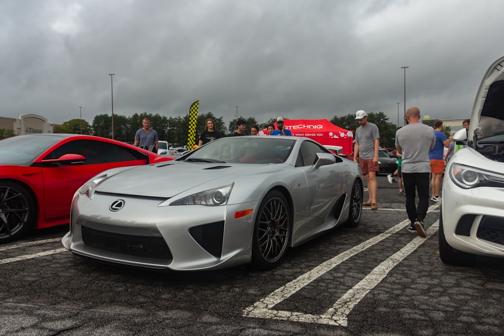 a silver sports car parked in a parking lot