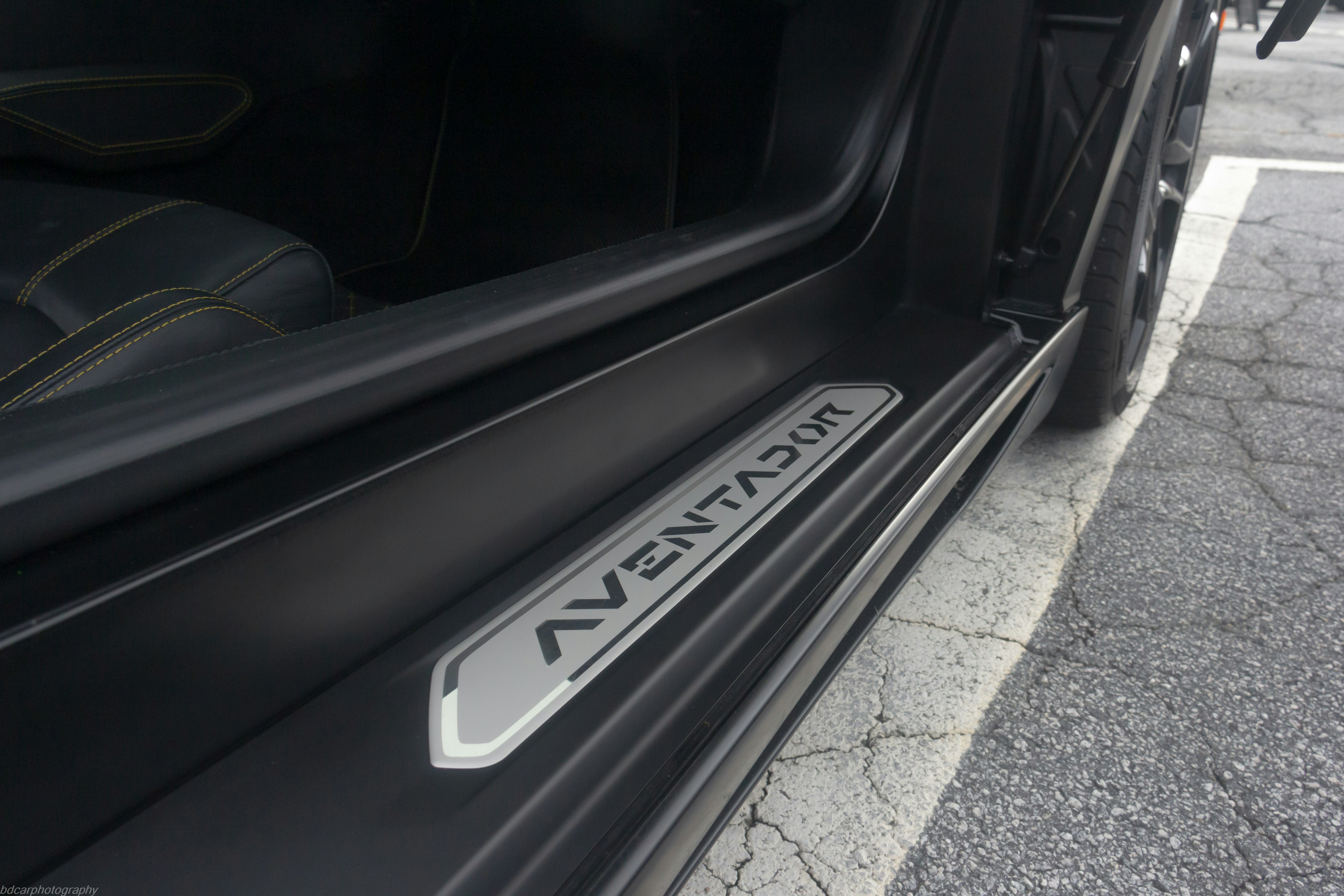 a close up of a car door with a sticker on it