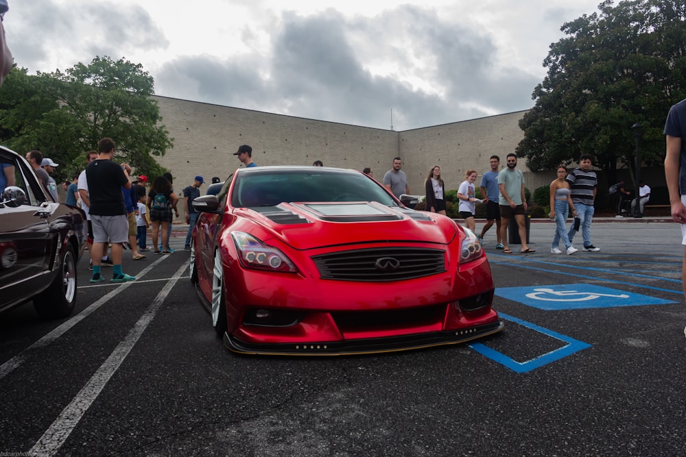 a red sports car parked in a parking lot