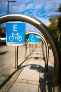 a blue sign that is on a metal pole
