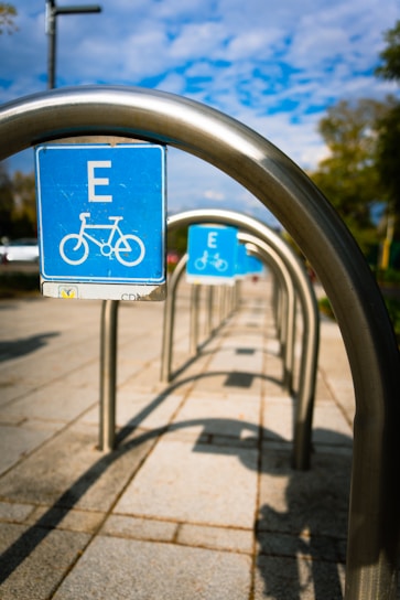 a blue sign that is on a metal pole