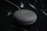 a google home mini sitting on top of a table