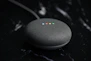a google home mini sitting on top of a table