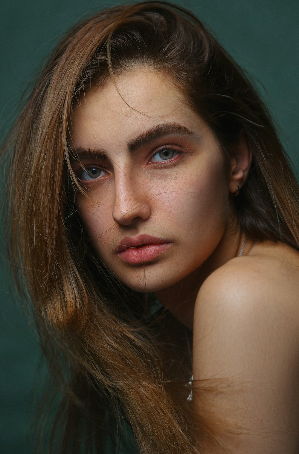 a close up of a woman with long hair