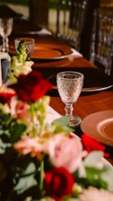 A beautifully set dining table with fresh flowers and delicious food.