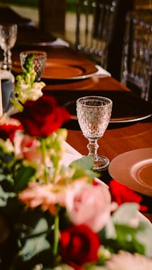 A beautifully arranged table set for a catering event with vibrant dishes and elegant decor.