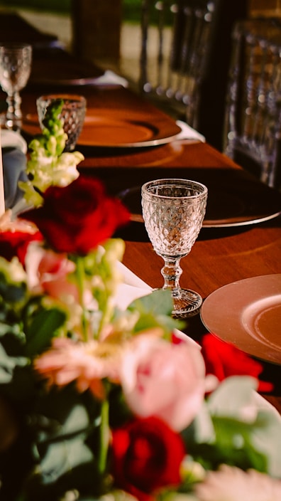 A beautifully set dining table adorned with a stylish tablecloth and matching decor.
