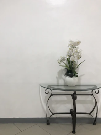 Elegant decorative items on a modern glass table