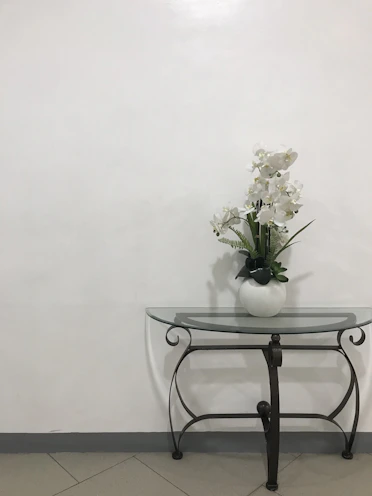 Elegant decorative items on a modern glass table