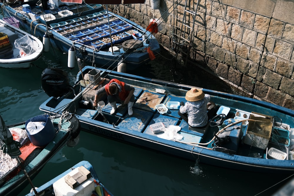 a man sitting in a boat in the water