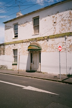 Commercial building with pest control signage at the entrance.