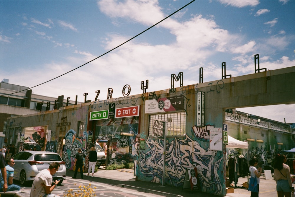 a group of people standing outside of a building