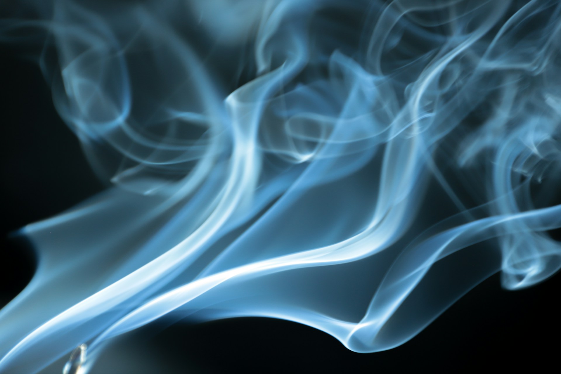 a close up of smoke on a black background