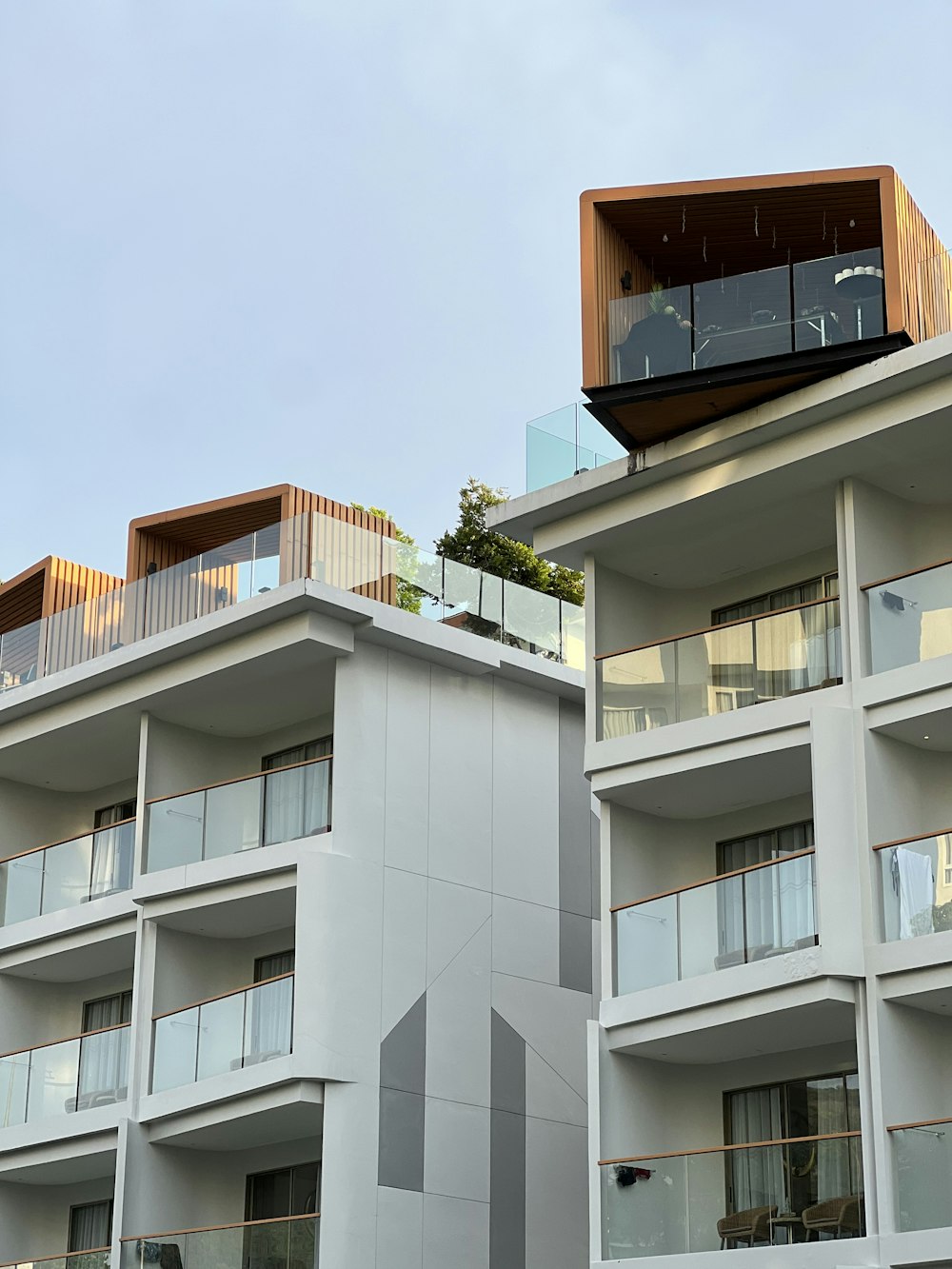 a tall building with balconies and balconies on top