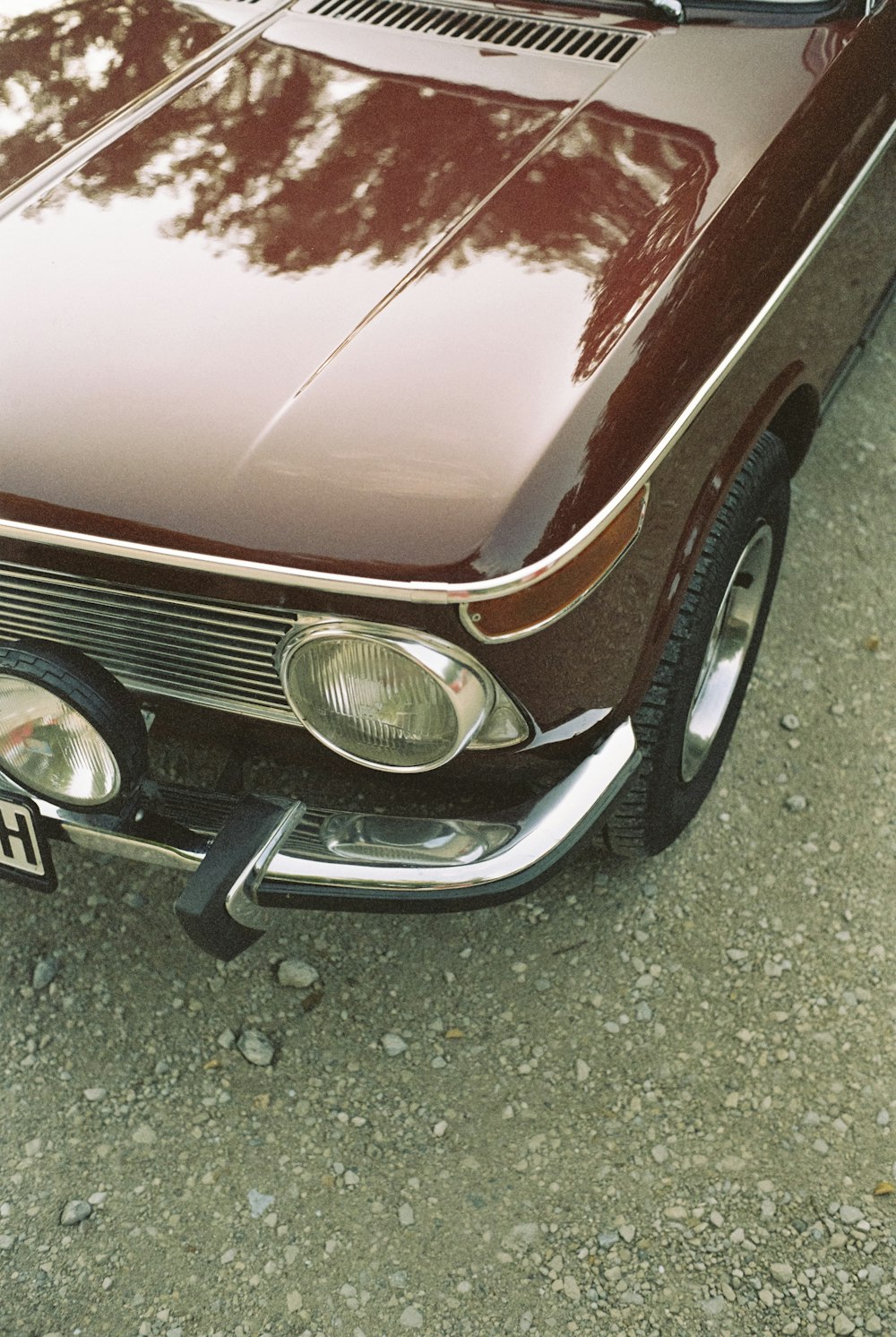 a brown car parked on the side of the road