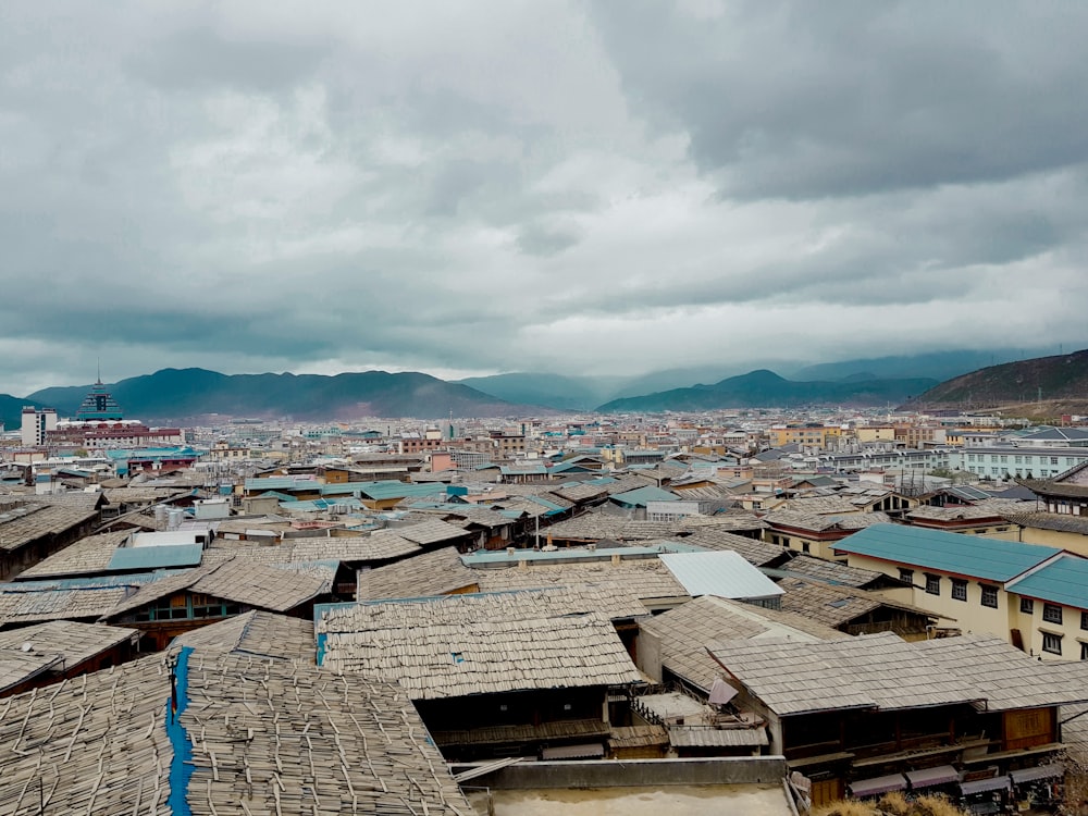 a view of a city with mountains in the background